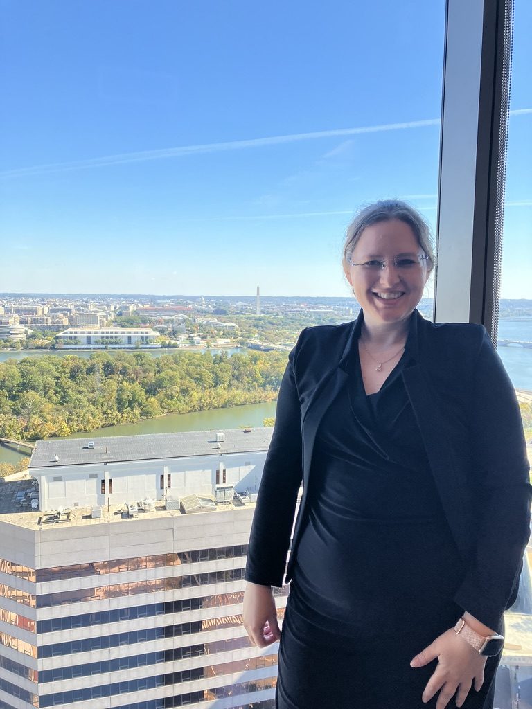 Juliane Smith, Esq. overlooking the Potomac River and Washington, D.C. skyline from Arlington, Virginia